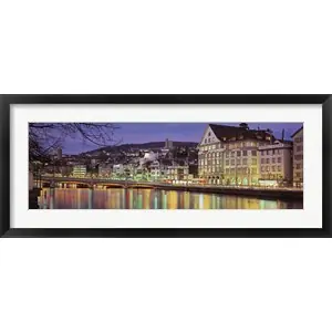 Genuine Switzerland, Zurich, River Limmat, view of buildings along a riverby Panoramic Images